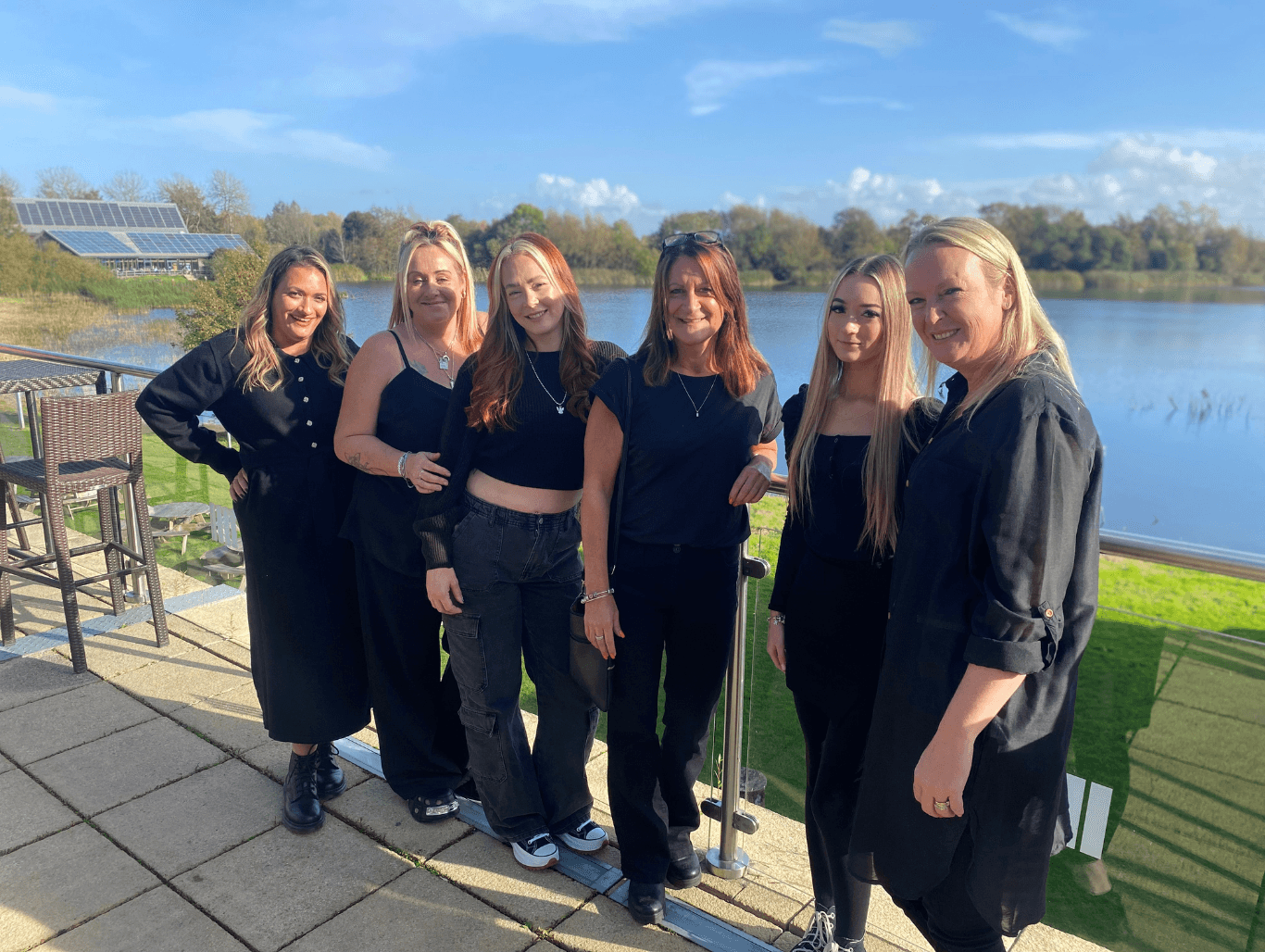 The Hair Pro UK team smiling together by the water in Bexhill-on-Sea — your trusted experts in personalised hair care and colour.
