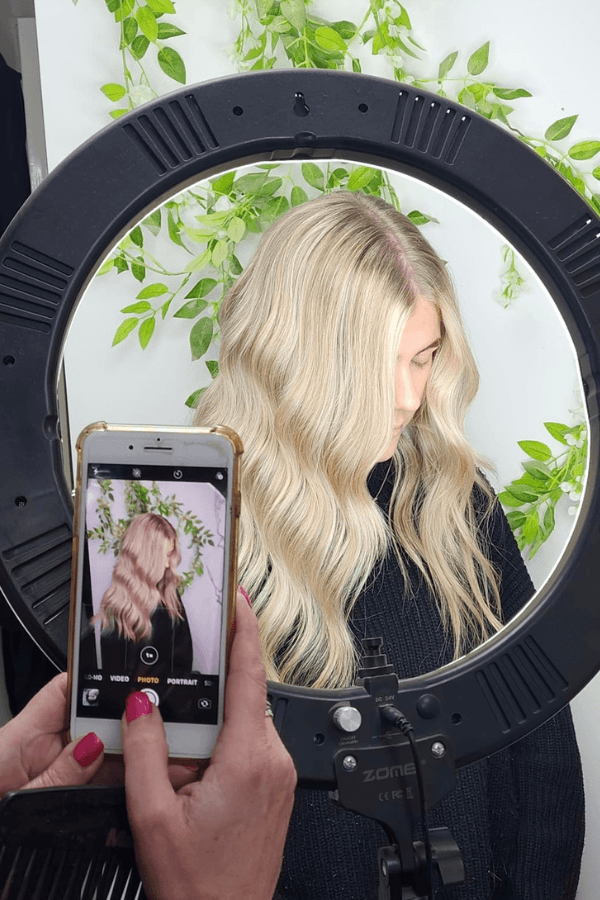 Close-up of soft blonde waves being photographed under salon lighting at Hair Pro UK, Bexhill-on-Sea.